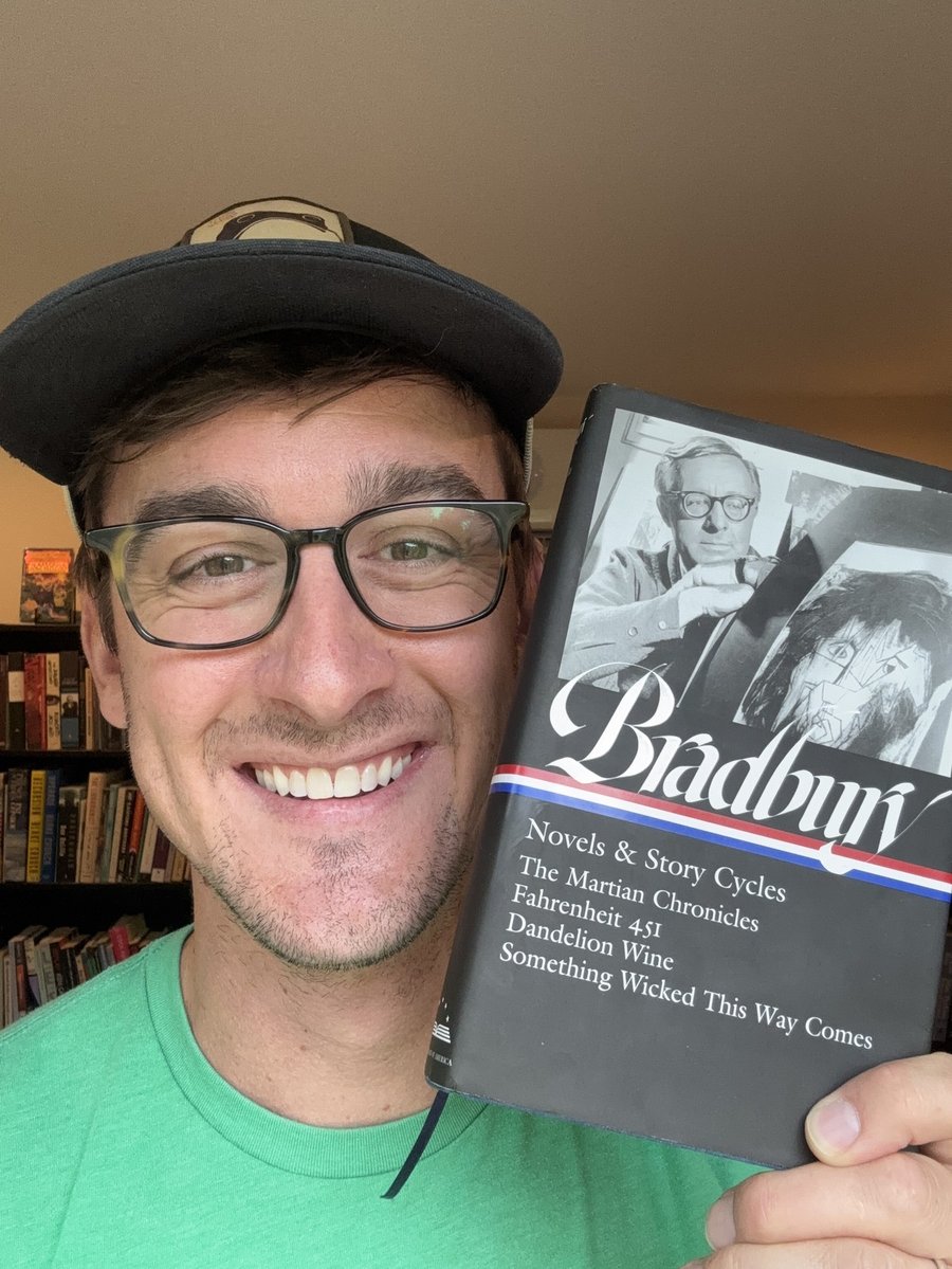 Will Pass holding Dandelion Wine by Ray Bradbury, his favorite book from August